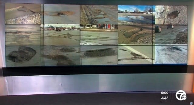 Assorted pictures of potholes in Michigan in a nightly news broadcast.