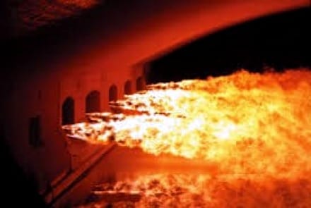 Float glass forming in a production glass furnace.